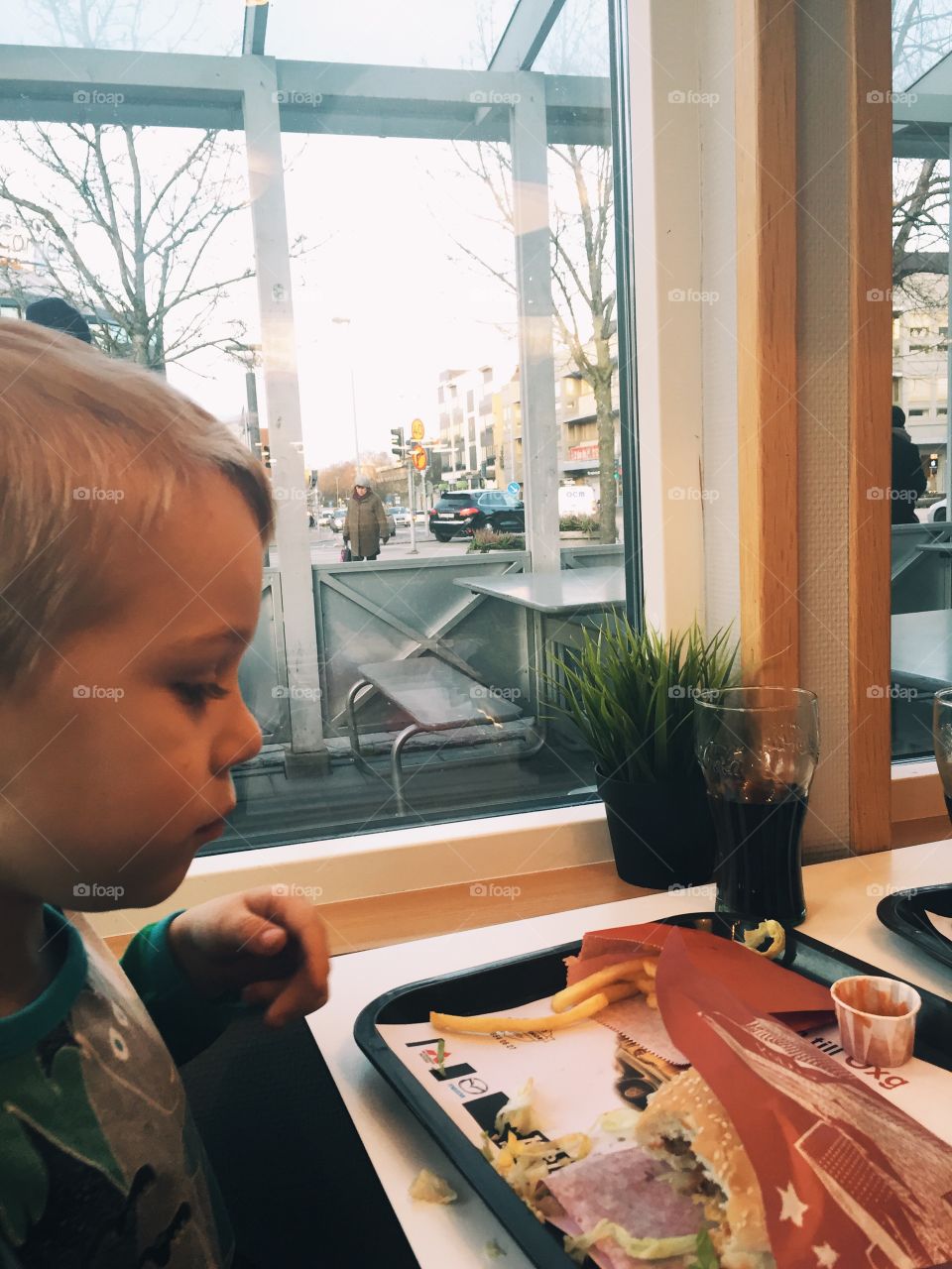 Boy eating fast food