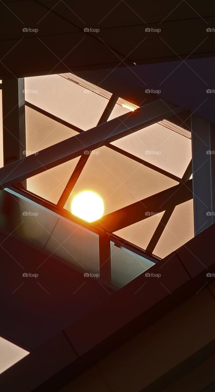 open air escalator and sunset