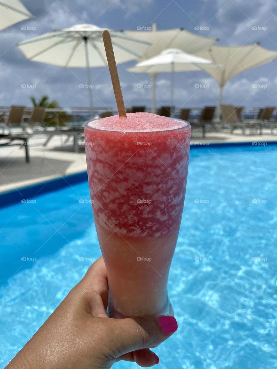 Cold refreshing drink by the pool