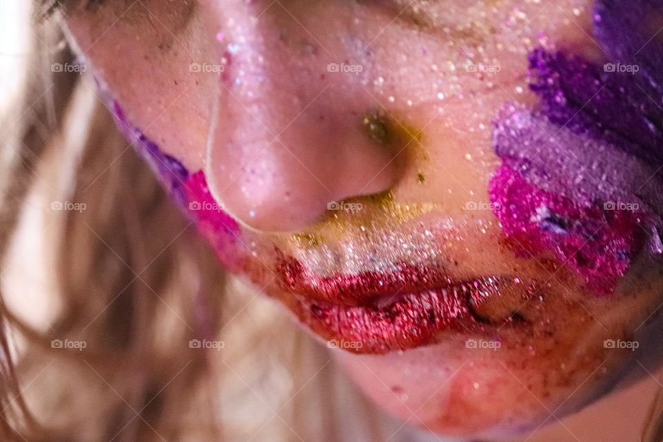 Child with glitter make-up