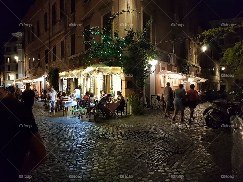 a small alley in trastevere in rome at night