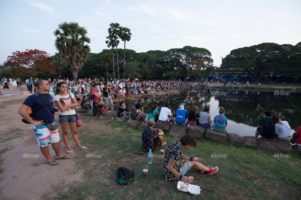 Tourist people waiting for the sunrise in front of the Ankor Wat temple in the morning in Siem Reap Cambodia 