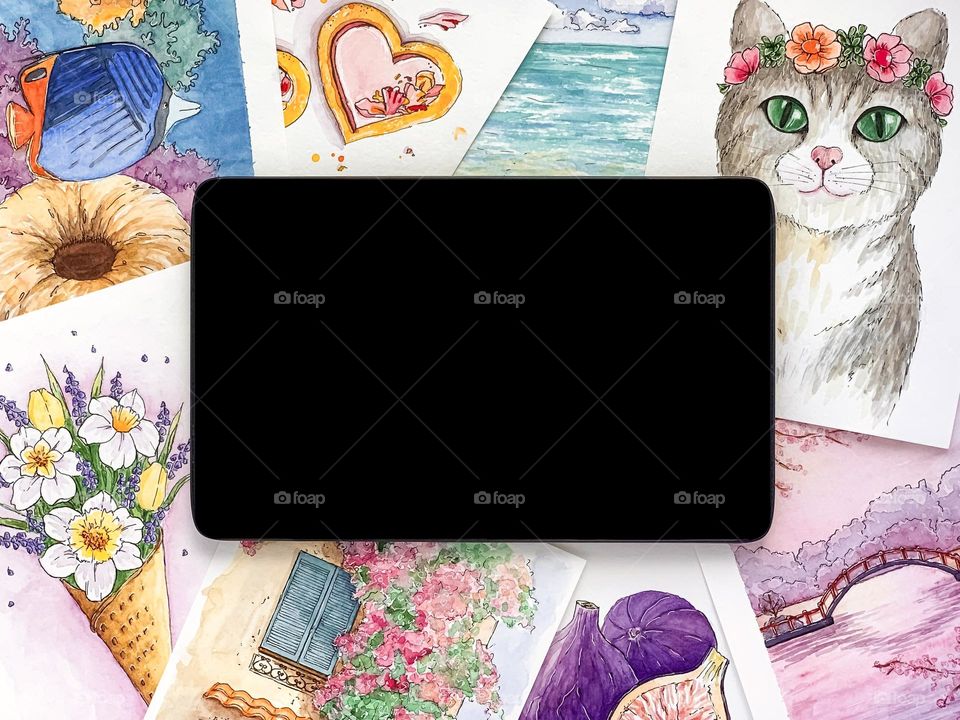 Black tablet, watercolor sketches. Online education.