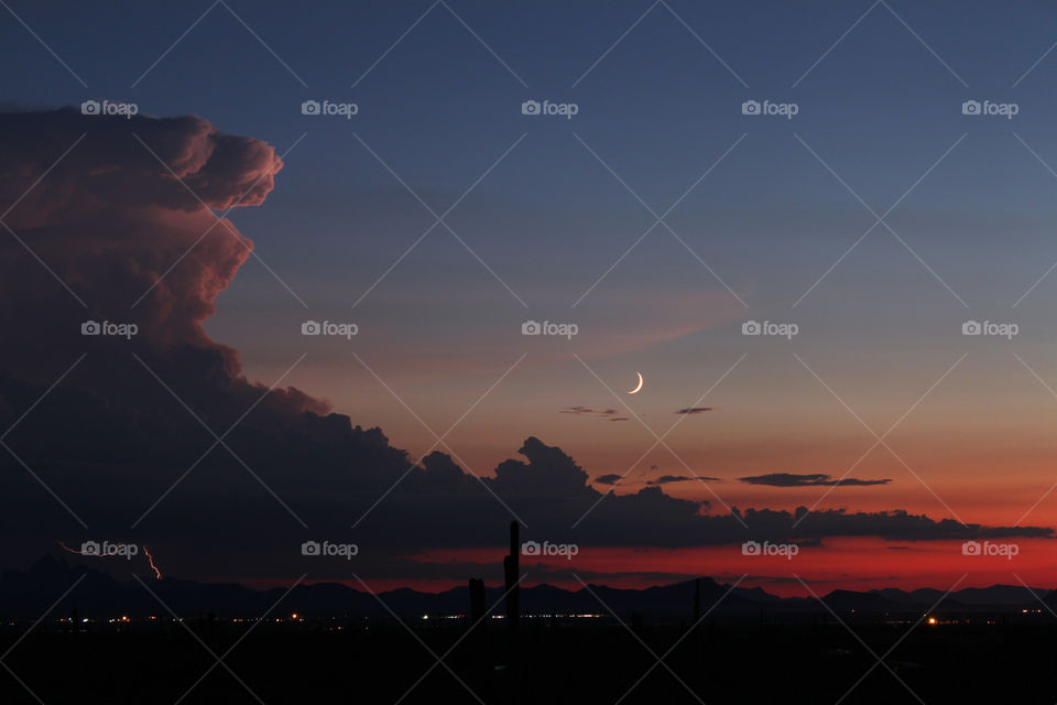 Crescent moon and thunderstorm 