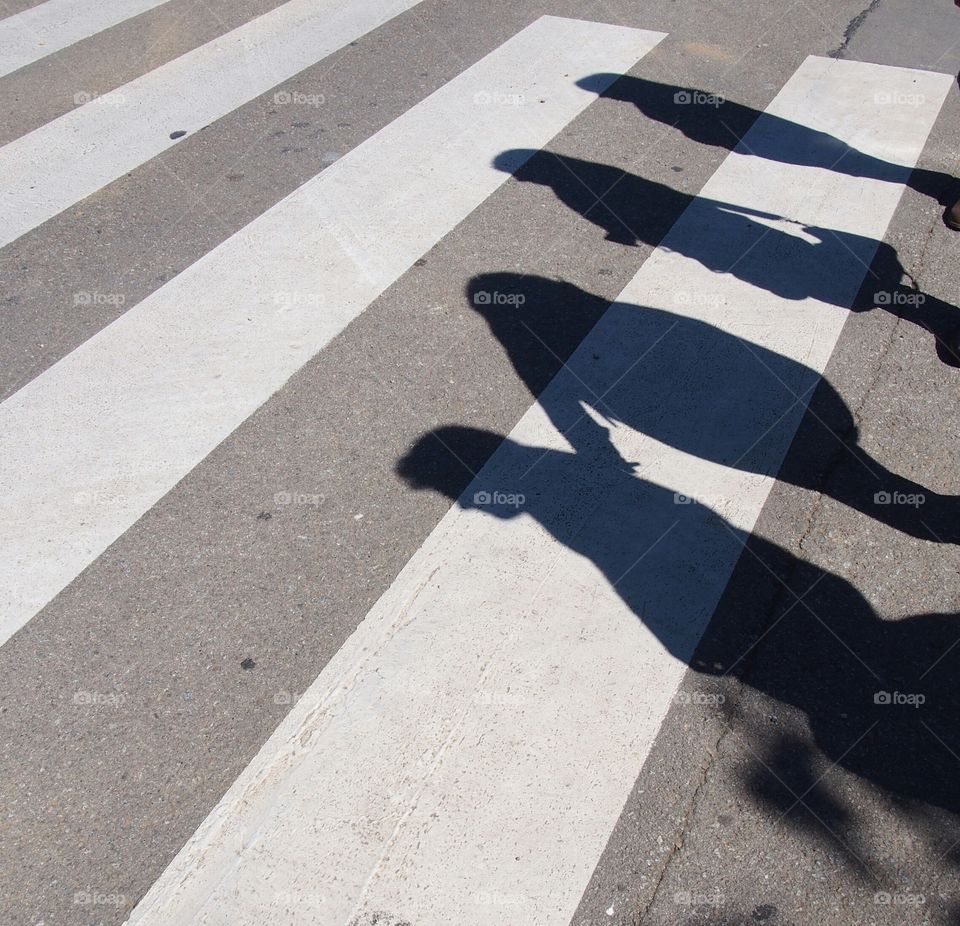 Pedestrian walking across a zebra crossing