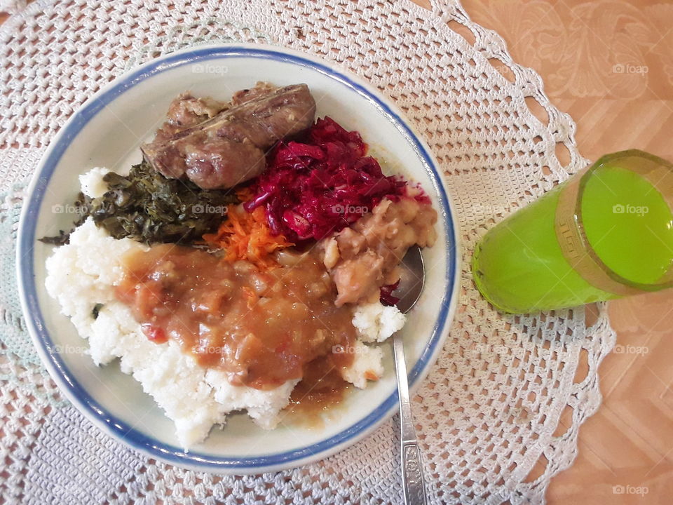 A lunchtime plate with a drink.