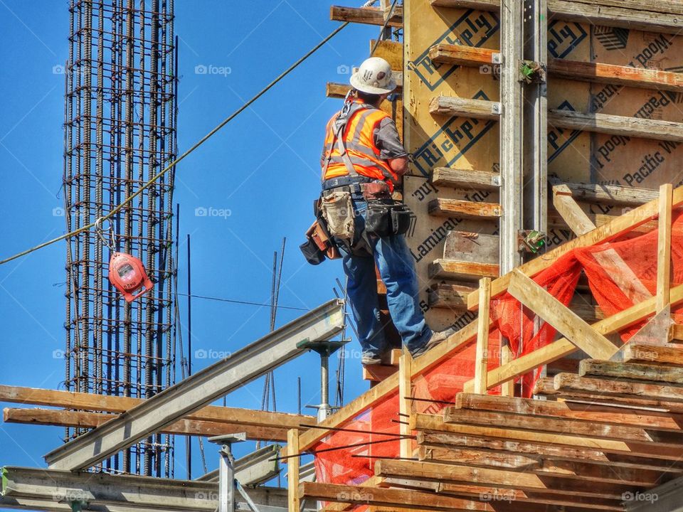 Workman Building A Skyscraper