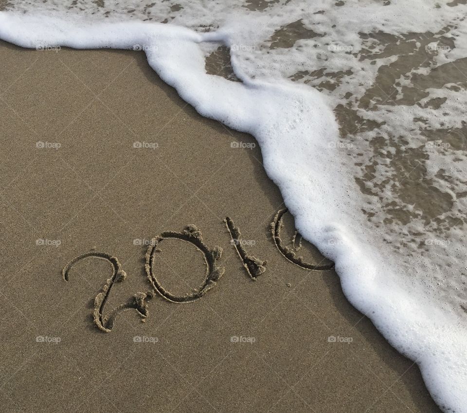 Numbers on sandy beach