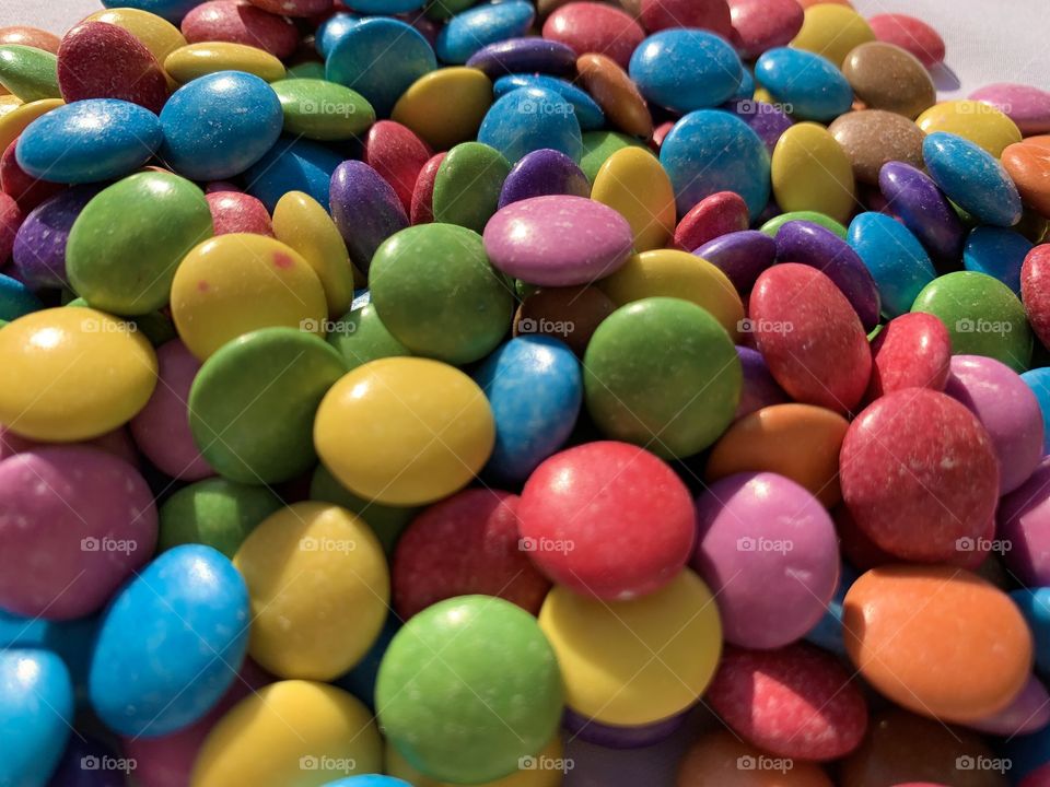 Smarties are the perfect ellipsis and so colourful. Just imagine how they melt in your mouth