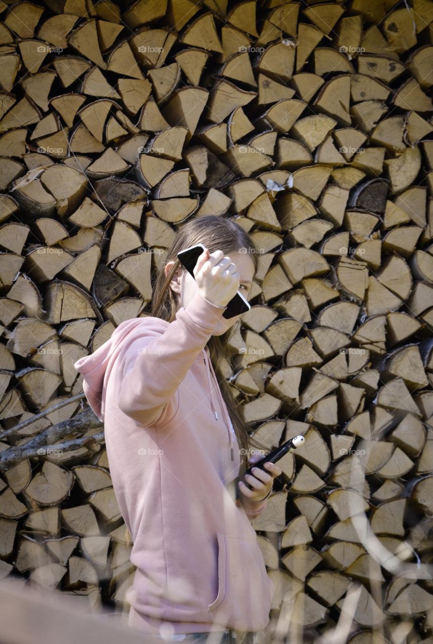 "In front of the triangles"