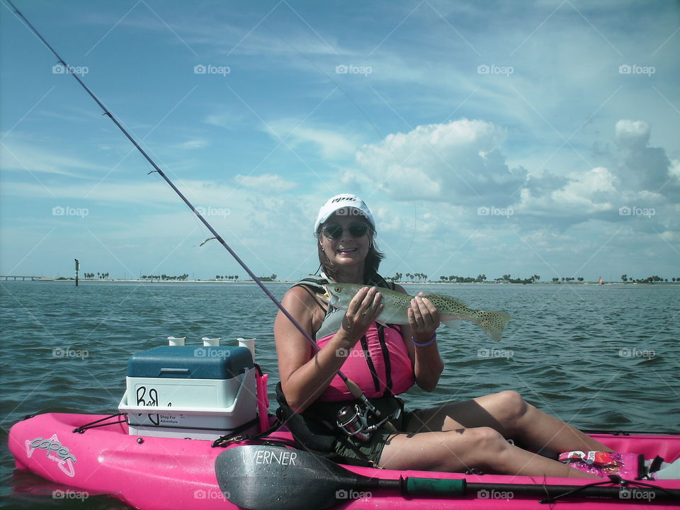 Woman holding fish