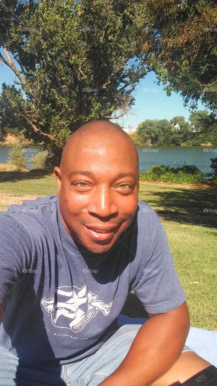 at the Sacramento River taking pictures