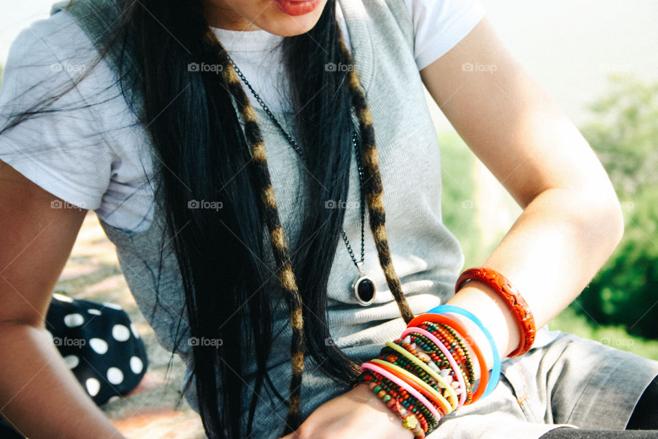 Girl wearing multiple bracelets