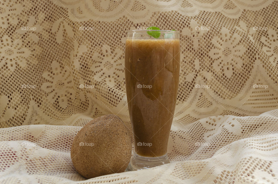 Sapodilla Juice And Fruit Side View