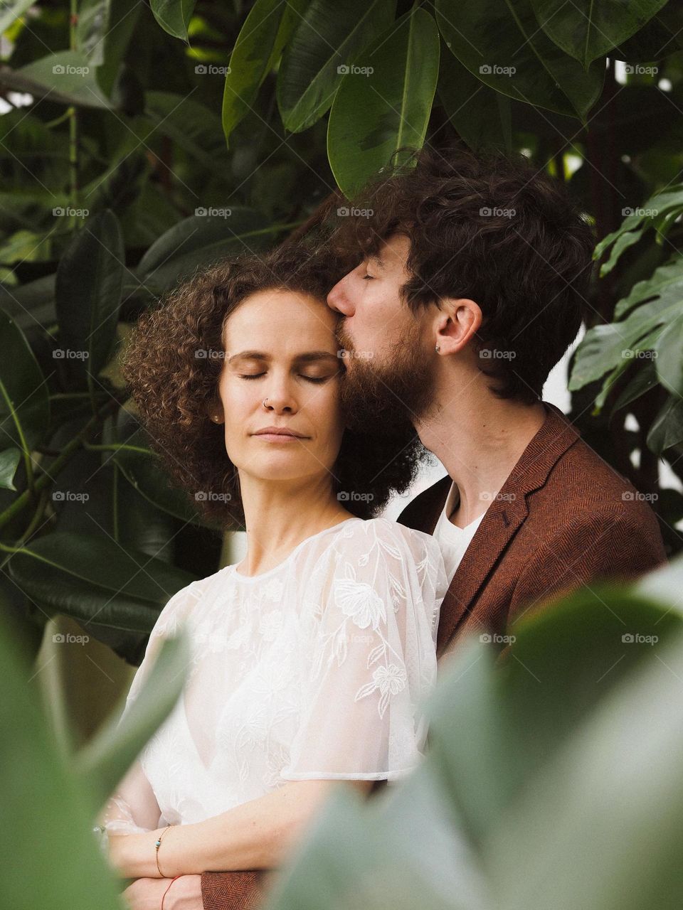 Beautiful lovers in botanical garden 