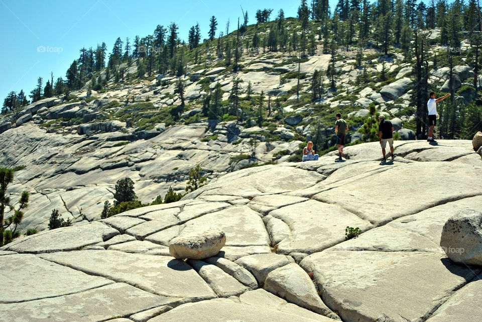 Hiking in a rocky mountain view point in summer