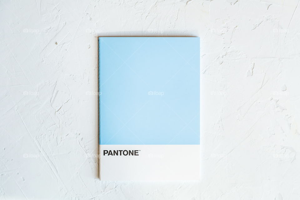 Blue color from Pantone on gray concrete background 