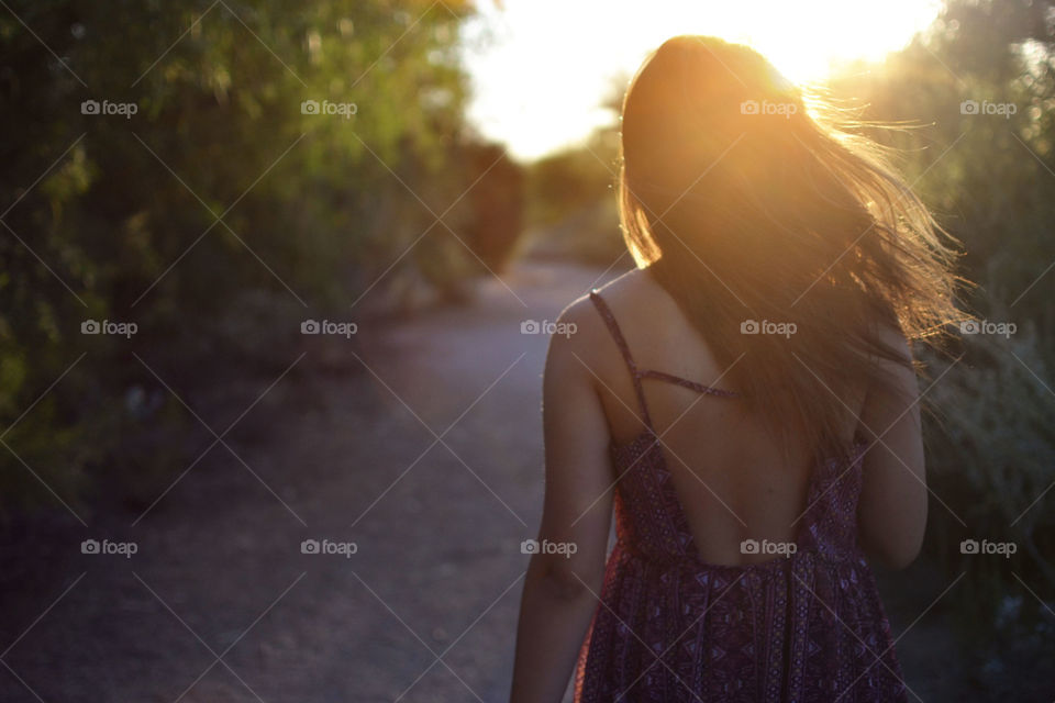 Wind Blown. Girl with hair blowing in the wind at sunset 