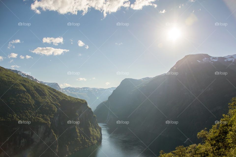 Tall Green Hills With A River Weaving In Between Photo