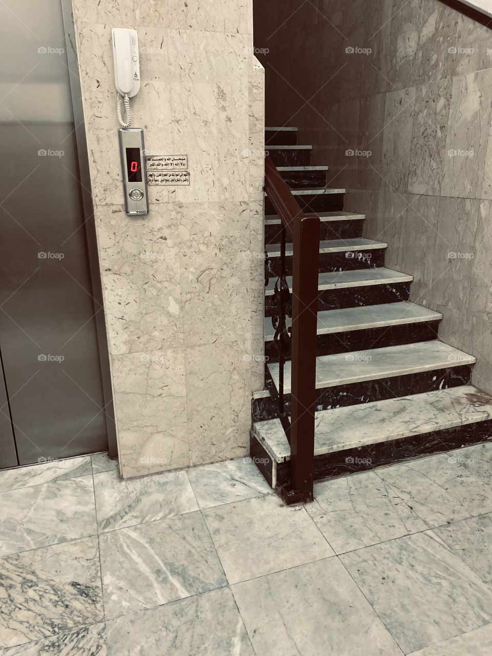 Remember of God at the elevator door to remind visitors to the mosque to remember and earn reward 