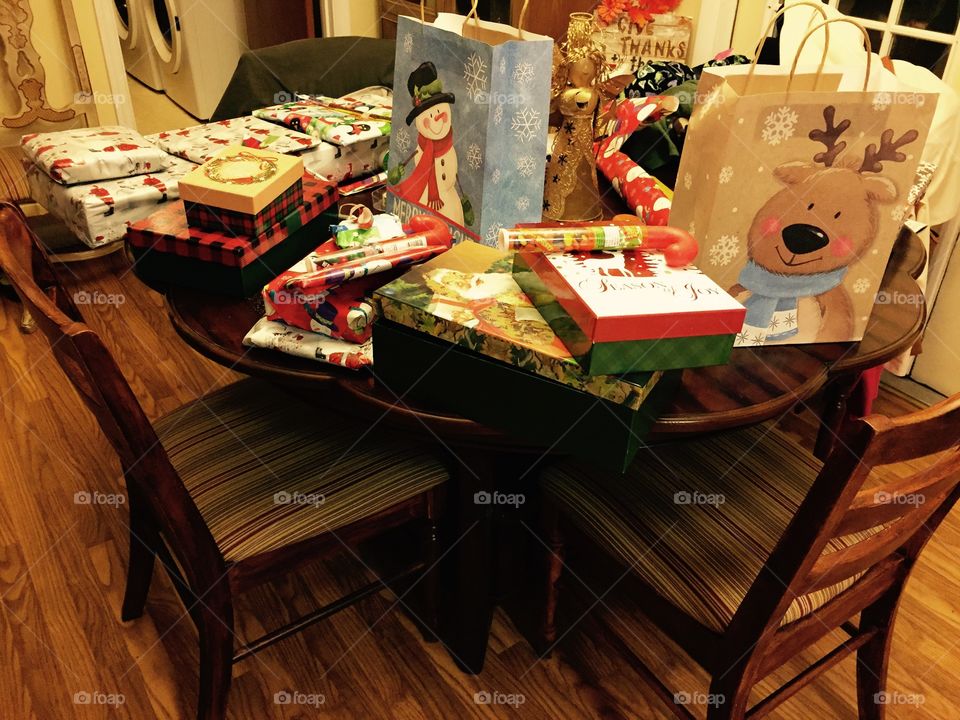 Christmas packages all wrapped and set on a table ready to be taken to our grandkids.