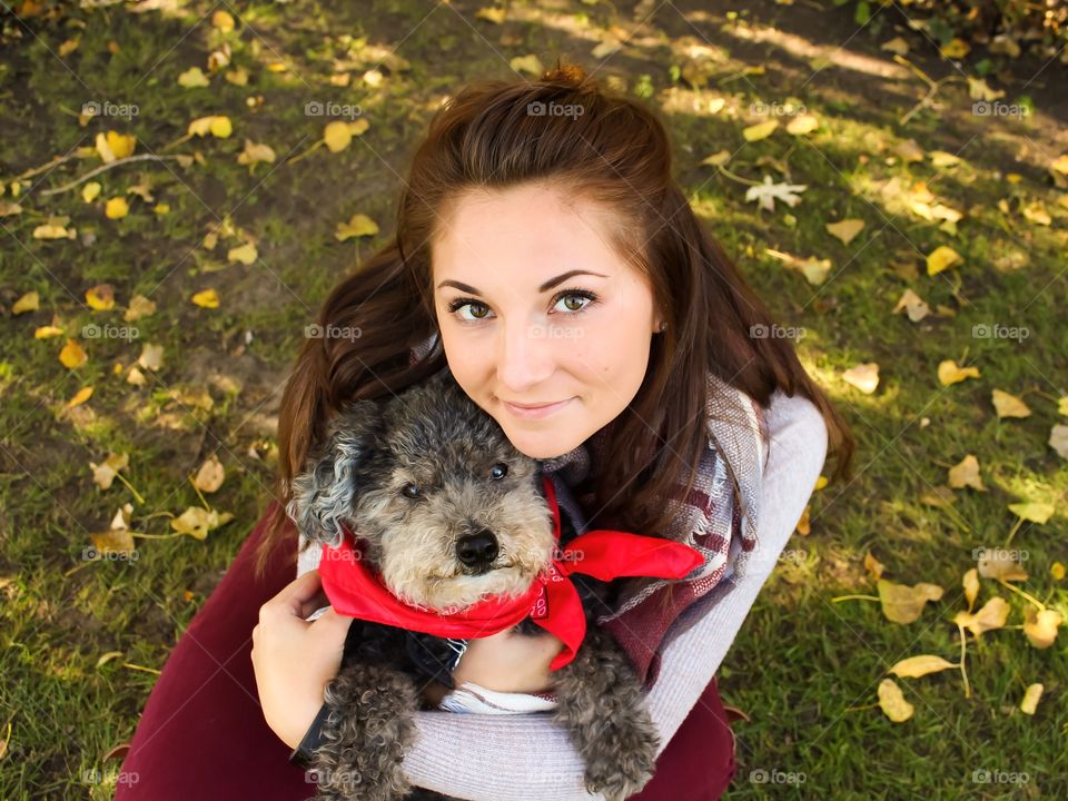 High angle view of young woman with dog