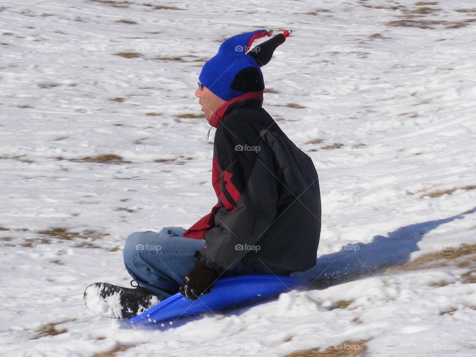 Man sledding fast