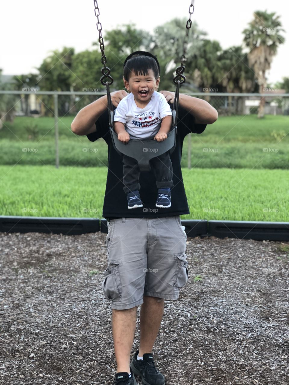 Happy Boy on Swings