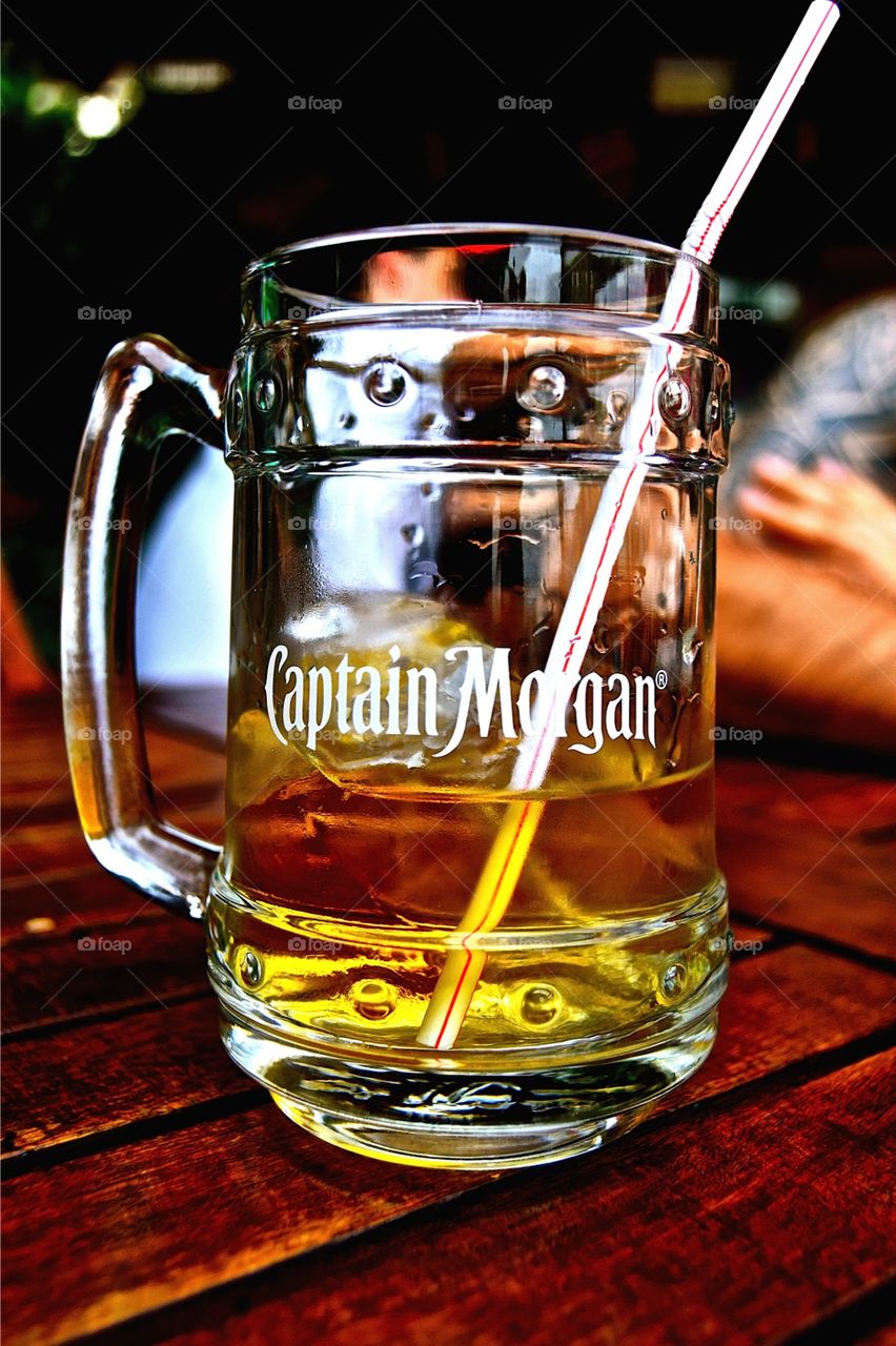 A cold glass of captain Morgan spice