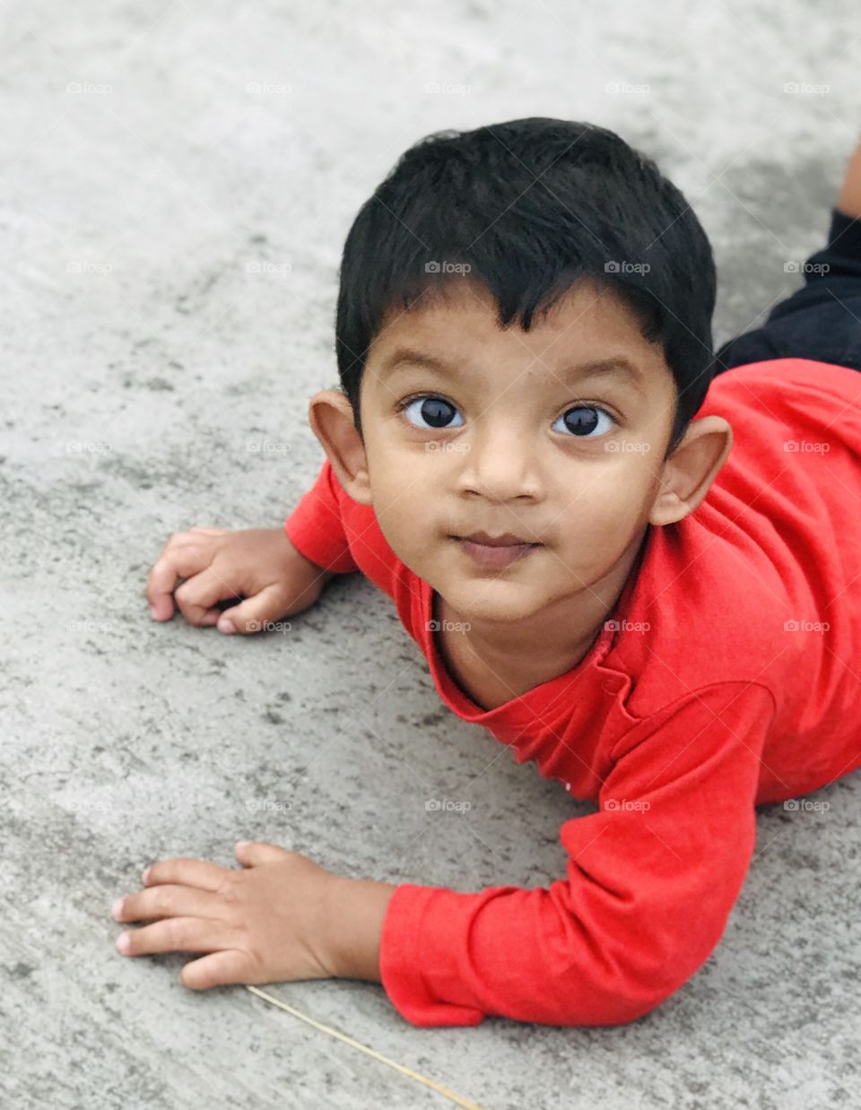 Cute Indian boy with red shirt 