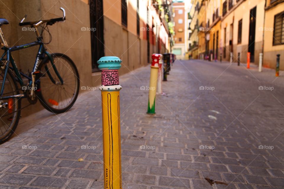 Decorated pavement poles