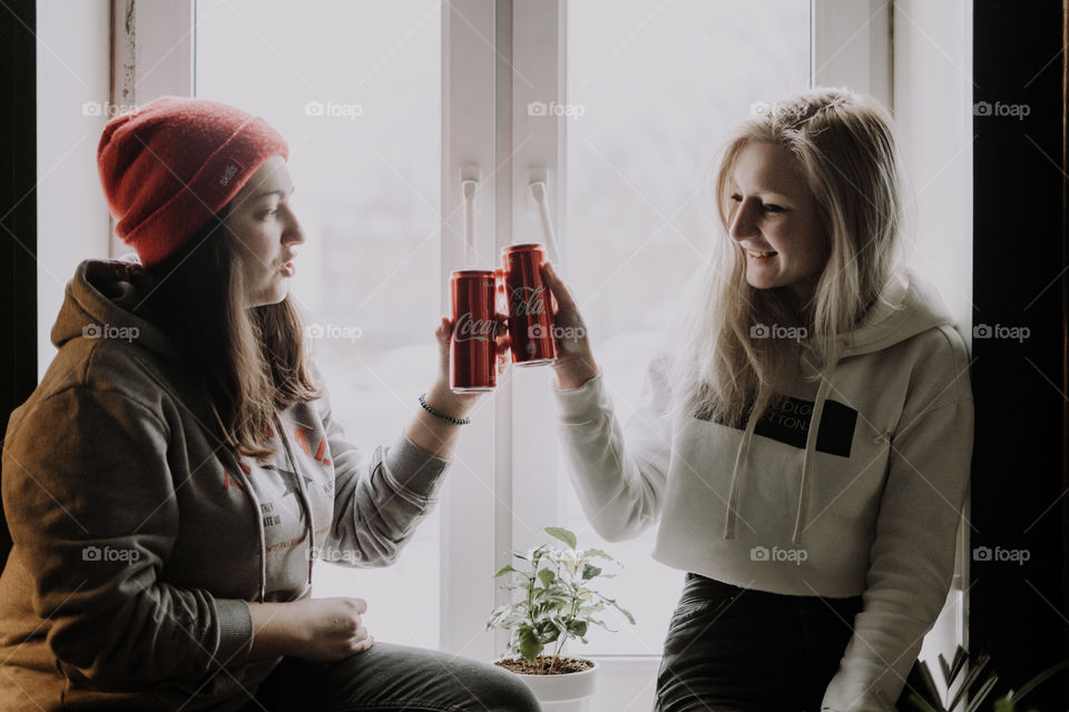 girls drinking coca cola