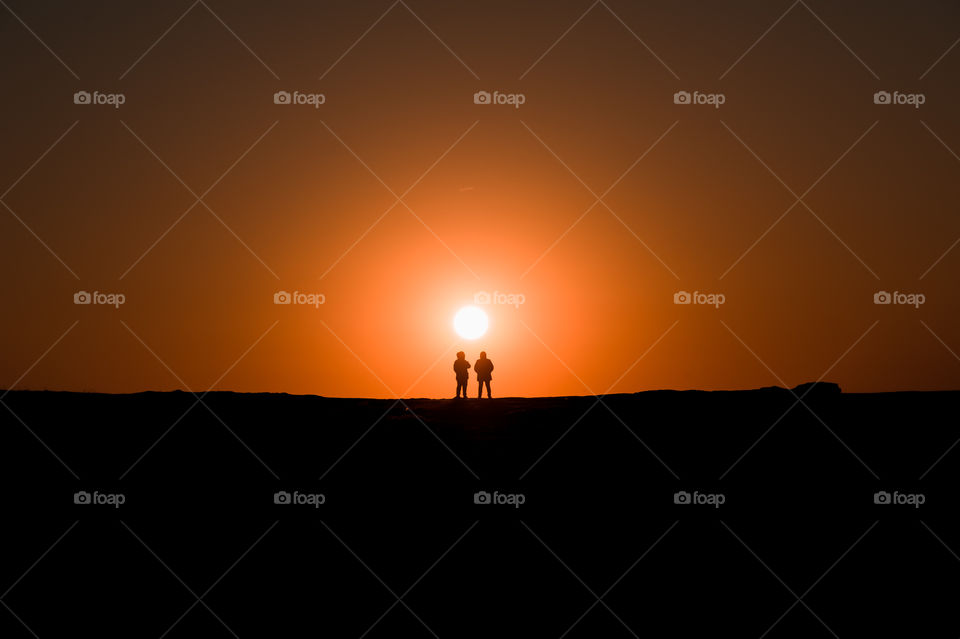 Two man and sunset