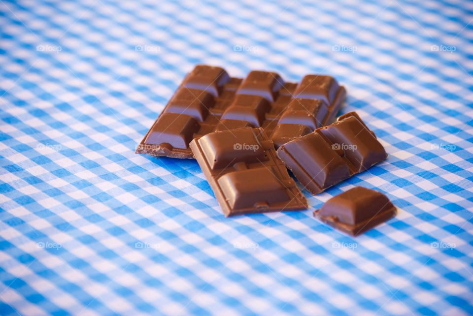 Chocolate on a blue and white tablecloth
