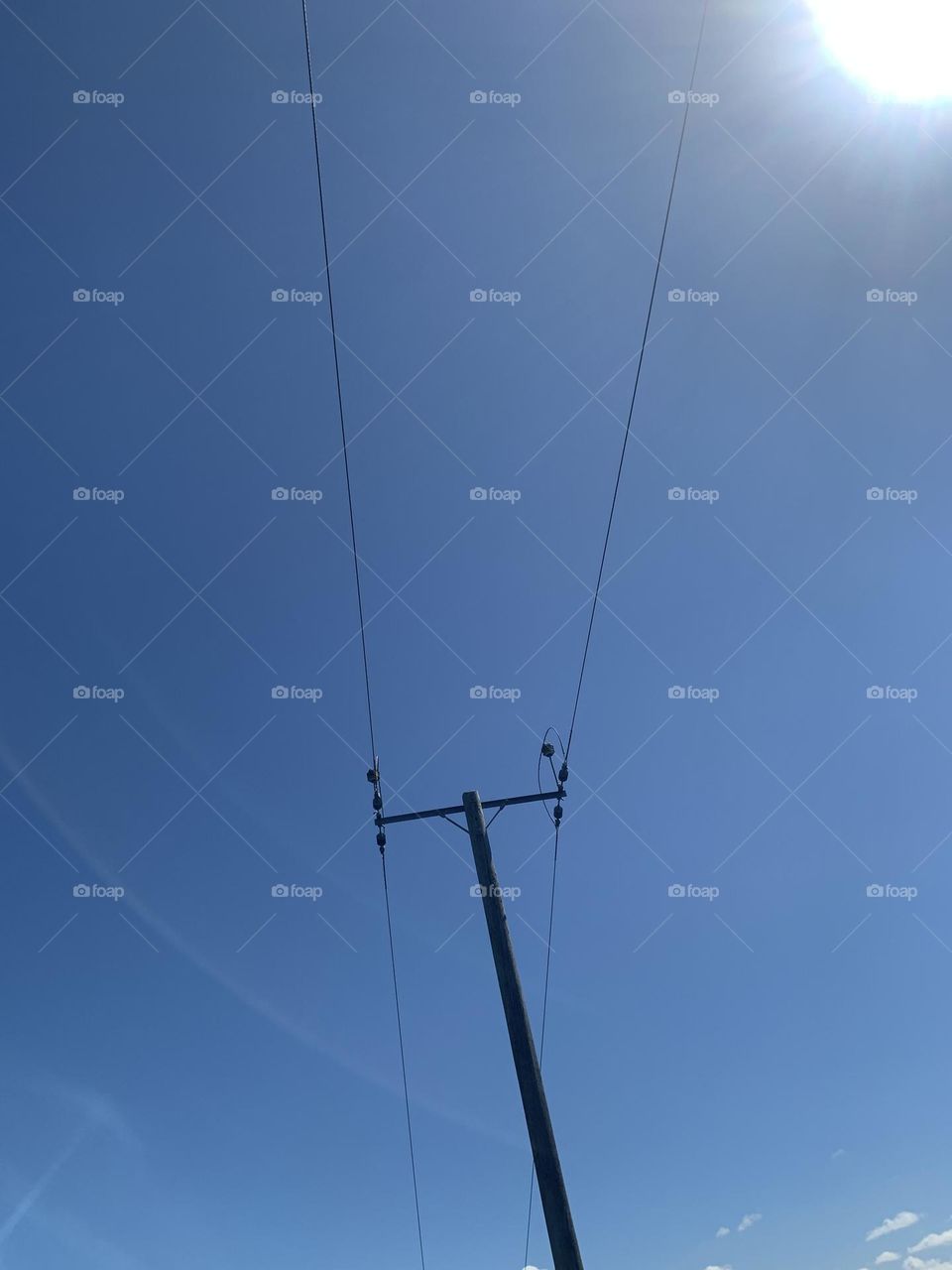 telephone line under summer skies