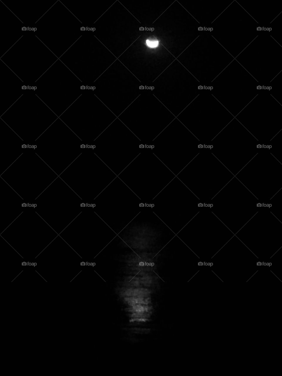 A crescent and its sea reflection