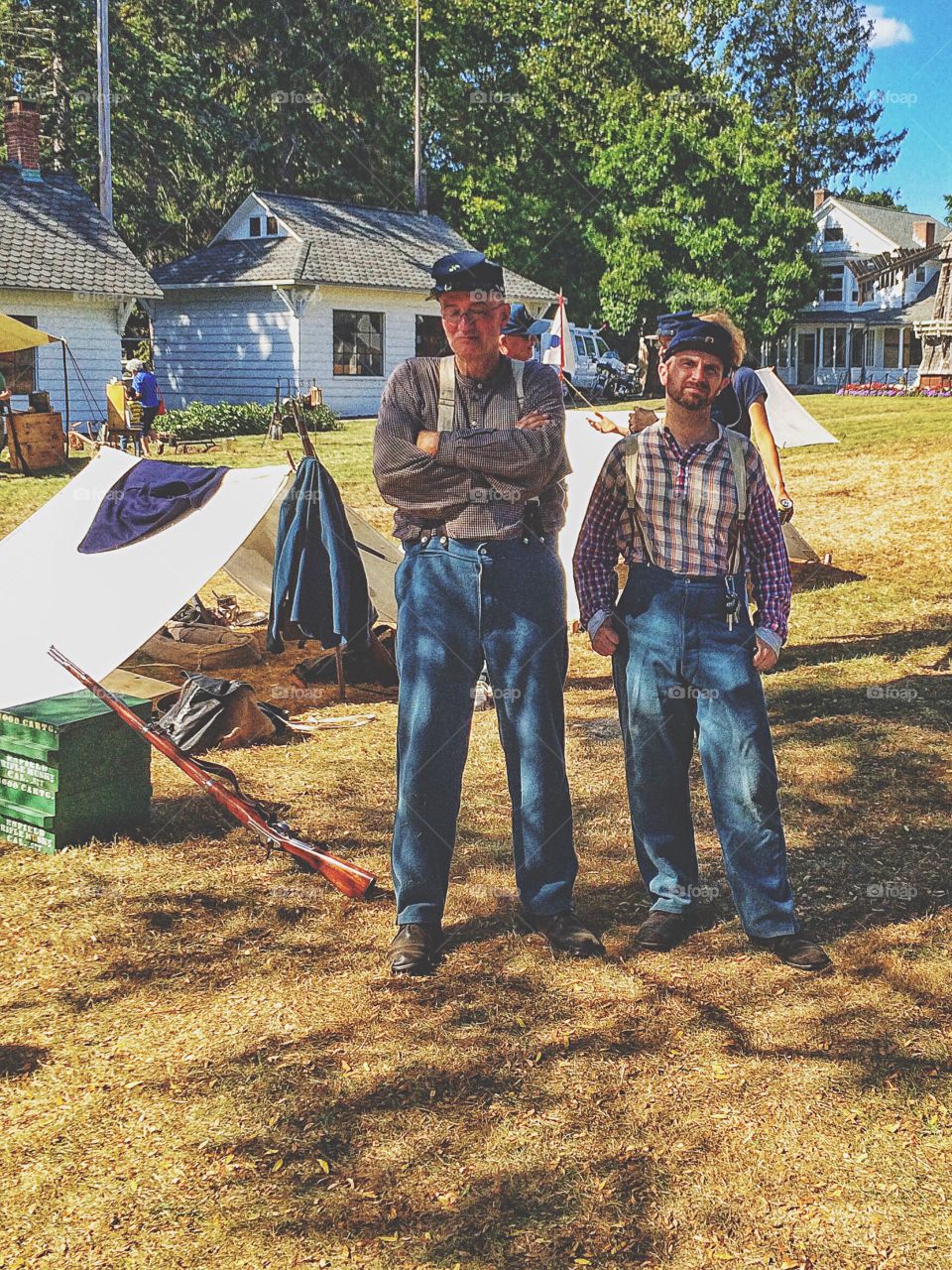 Two man standing on grassy land