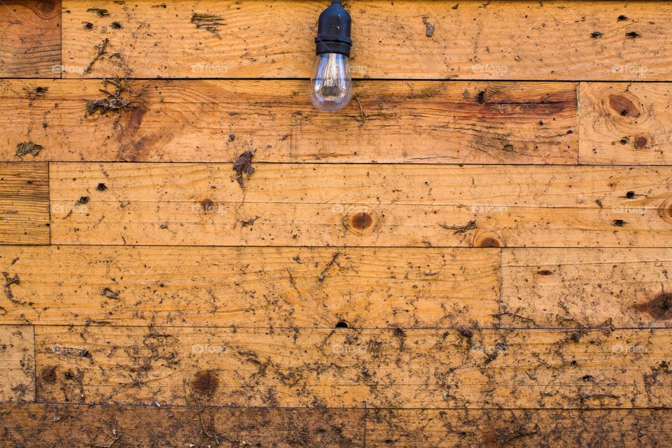 Lamp on wooden background 