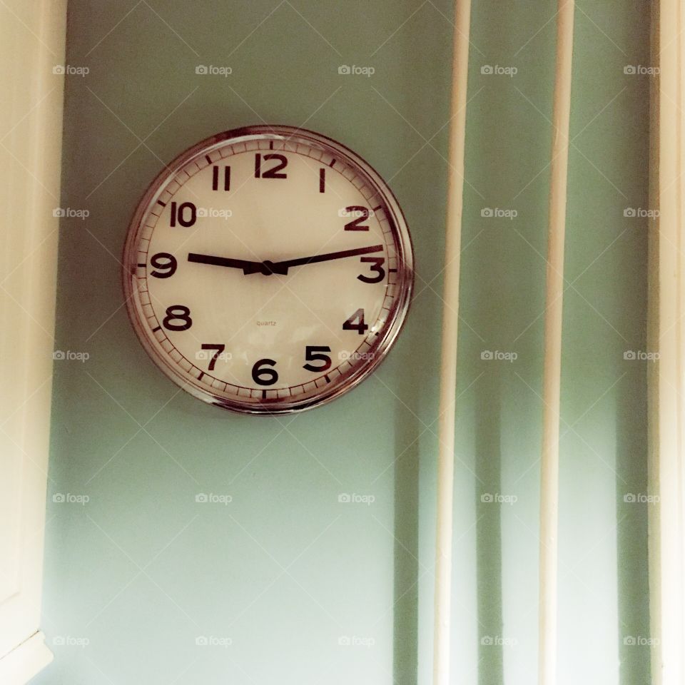 Clock on a light blue wall
