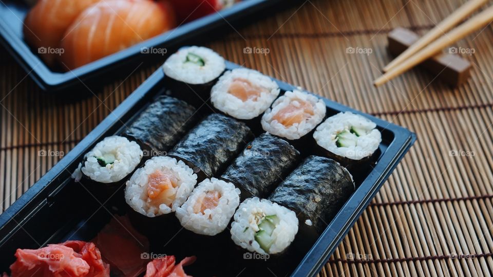 Close-up of sushi with chopstick