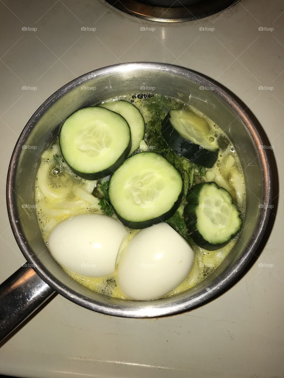 Udon Dinner Being Cooked. Vegetables and eggs are added to spice up the Japanese noodle.