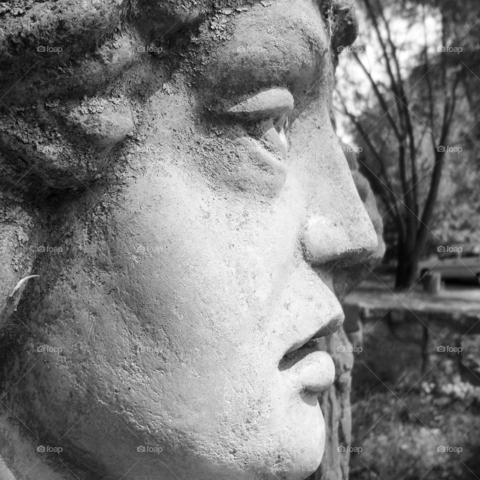 stone face of old sculpture