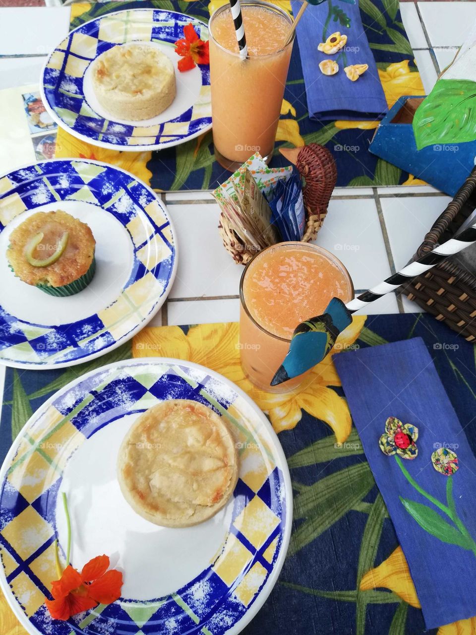 blue and white summer table with juice and vegetables pies