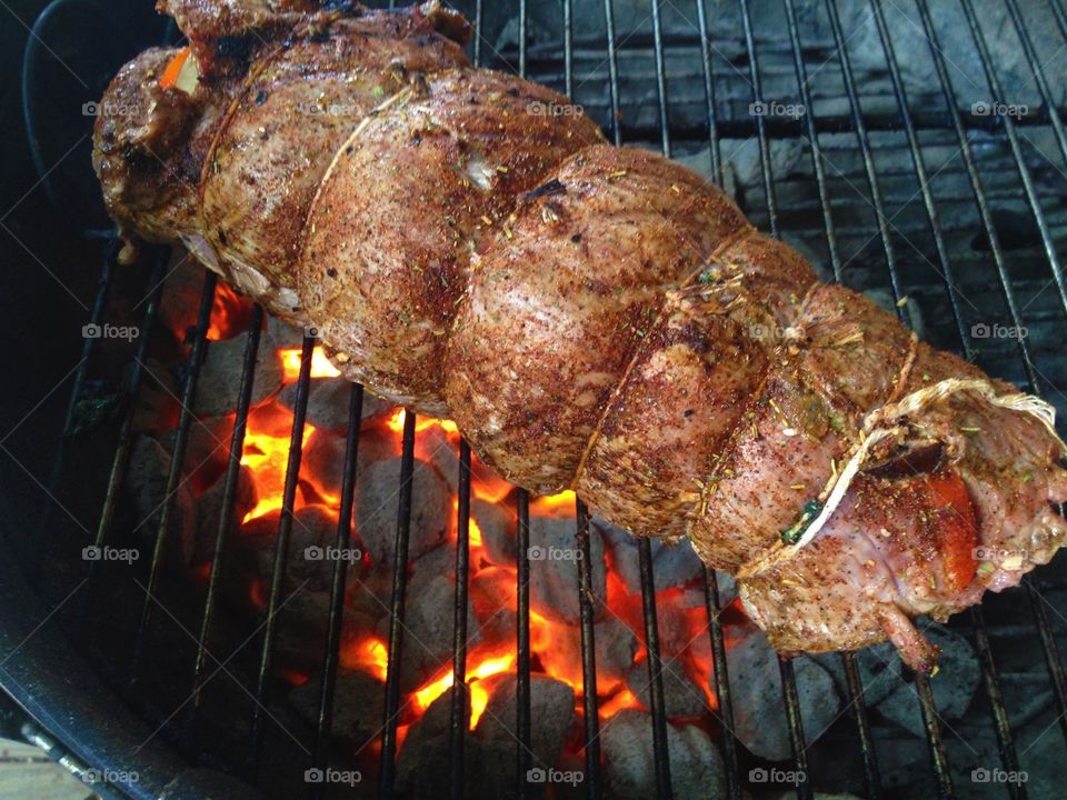 Rolled stuffed tenderloin on the grill
