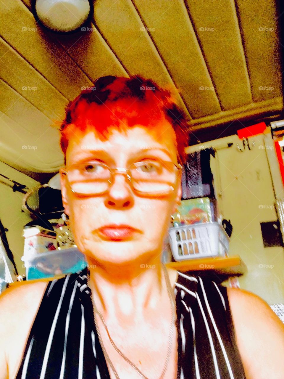 Here I am, “Petra Schiller” a.k.a. “Maxine Firefox” a.k.a. “Maximiliane Feuerfuchs” in black and white vertical stripes and not to forget bright red hair aboard the “Salvation”, our “28 foot 1969 Luhrs” cabin cruiser. 2023. Hypnotic Productions