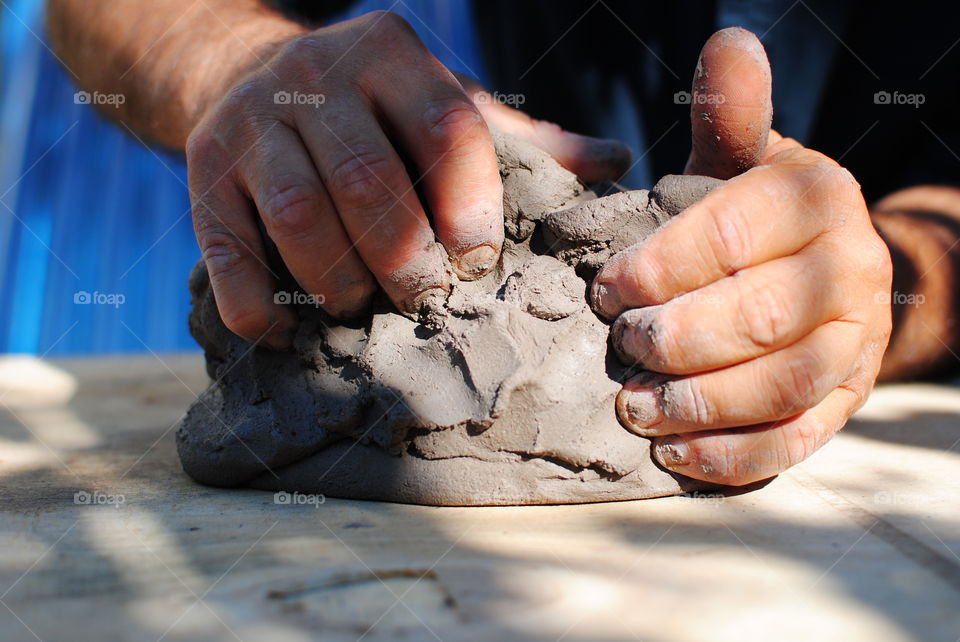 My hands modeling the fireclay. The four elements ... "earth, water, air and fire" that combine to create beautiful ceramic furnishings with the ancient Japanese technique of RAKU. i4elementi.it