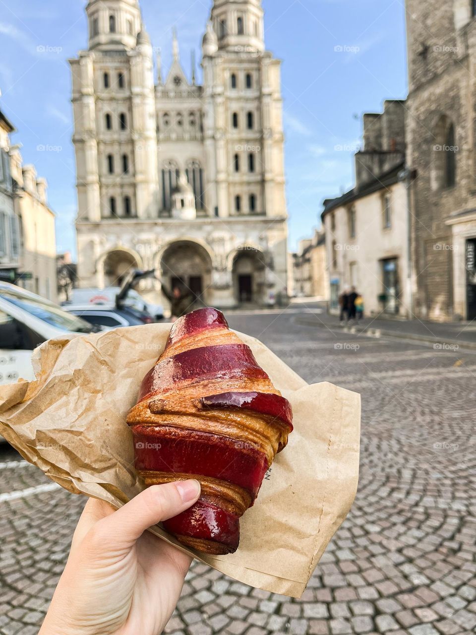 A delicious fresh croissant on the streets of Dijon France.