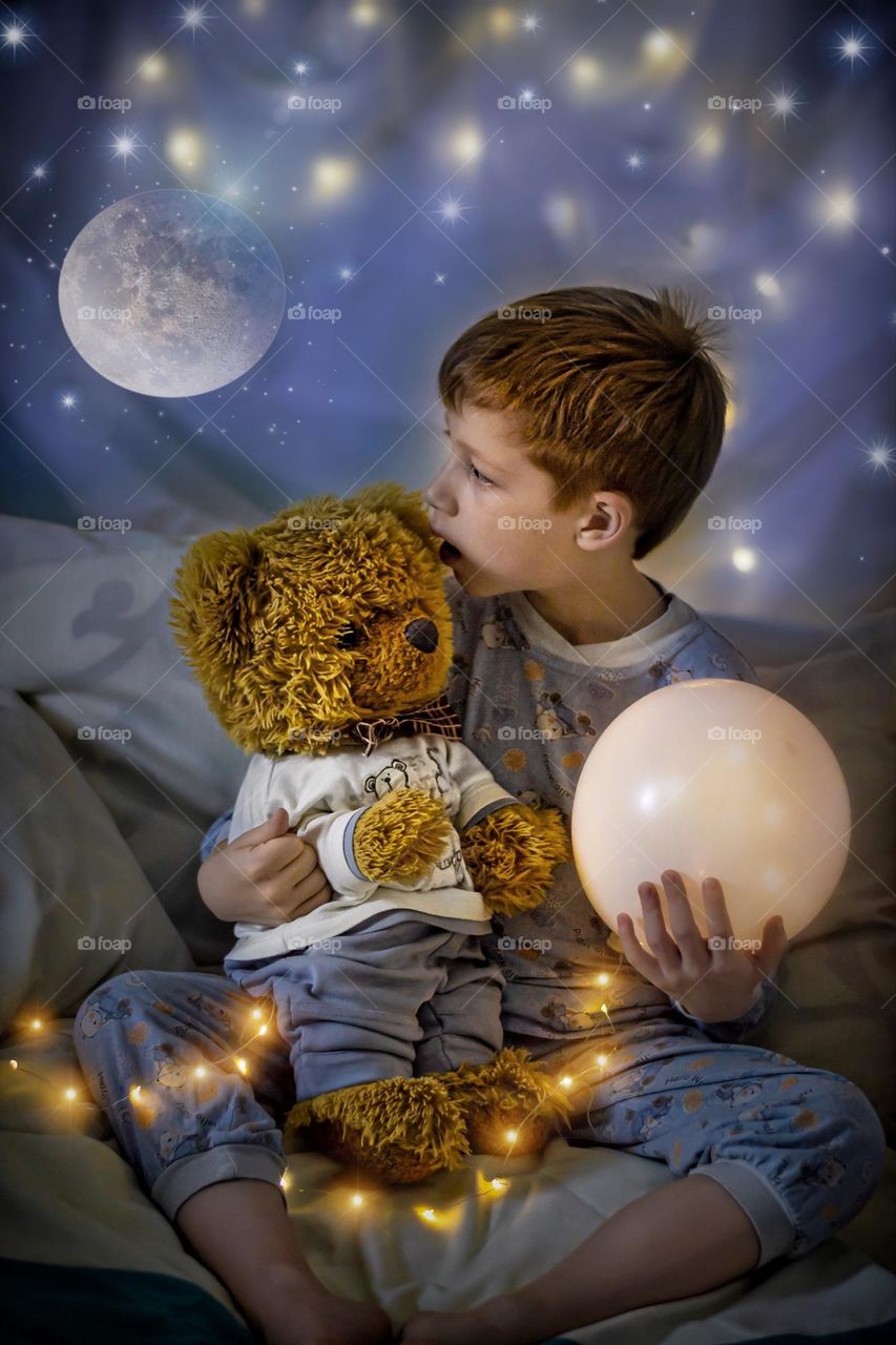 art photo child and teddy bear on blue photo