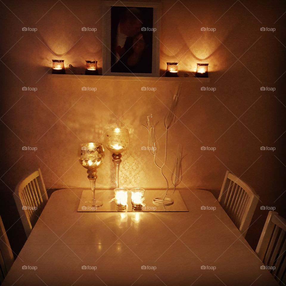 Illuminated lamp on table at restaurant