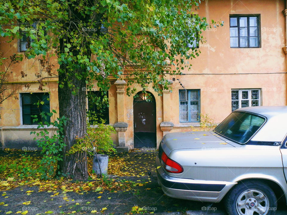 the car is near the entrance of the old house, autumn, Kiev